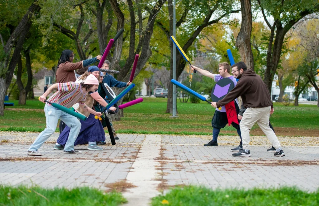 A group of young people LARPing (live action roleplay)