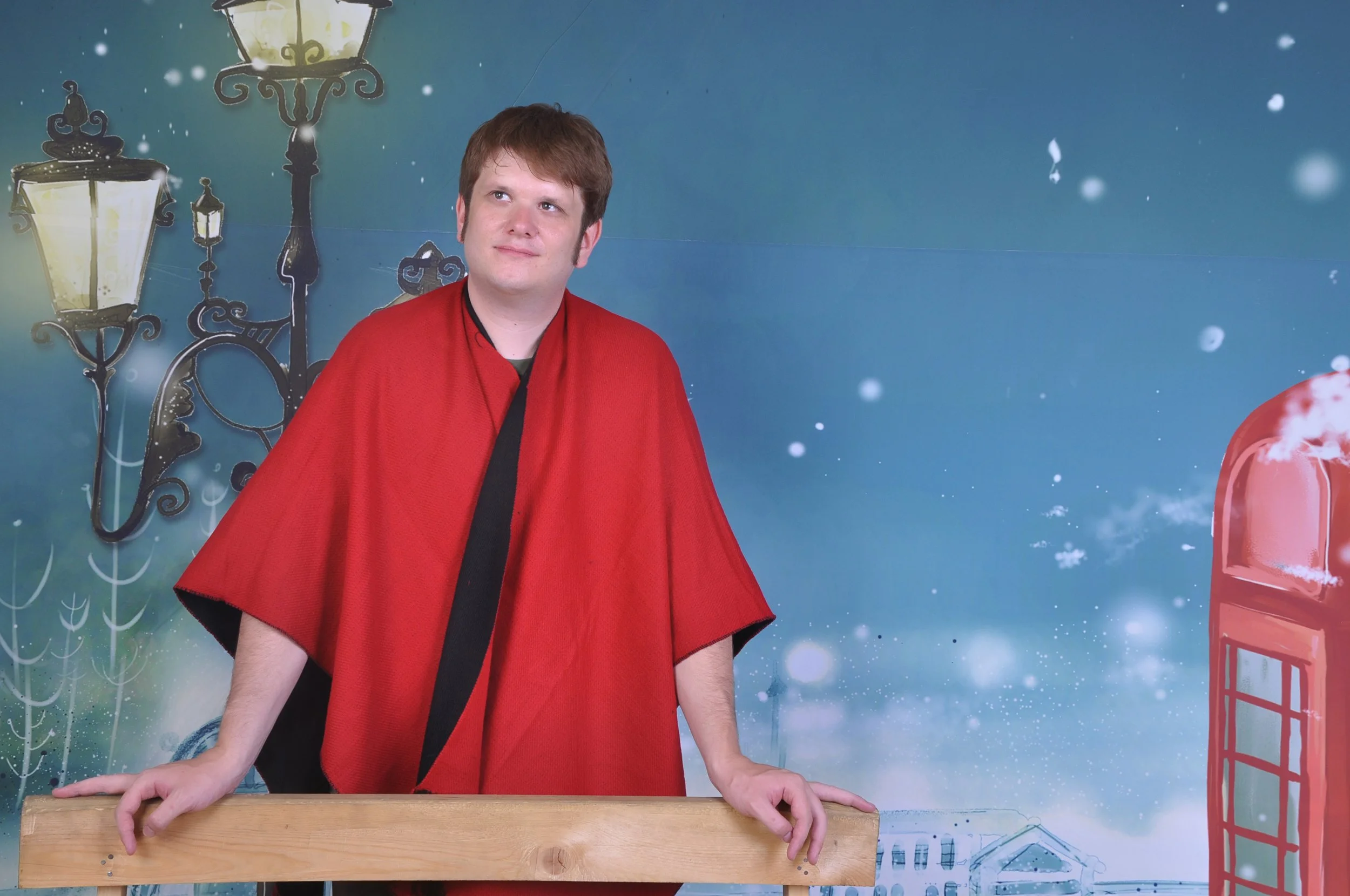 ozject in a winter wonderland, wearing a majestic red shawl