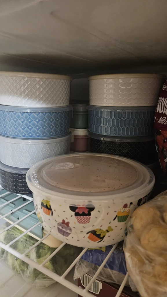 A freezer showing bowls of Ozject's 8+1 chilli, prepared and ready for the next two weeks of work.
